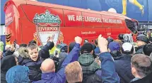  ??  ?? Reds alert: Everton fans make their feelings known as the Liverpool coach arrives at Goodison Park