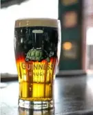  ??  ?? A Black and Tan, also known as a half and half, combines Guiness stout (black) and Harp lager (tan).