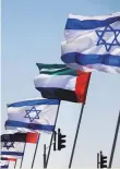  ?? Reuters ?? The flags of the UAE and Israel flutter on an Israeli highway after the peace accord was announced.