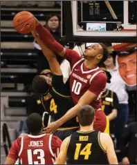  ?? The Associated Press ?? NOT TODAY: Arkansas’s Daniel Gafford (10) blocks the shot of Missouri’s Javon Pickett (4) during the first half of Tuesday’s game in Columbia, Mo.