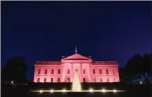  ?? MANDEL NGAN / AFP ?? The White House is illuminate­d in pink for Breast Cancer Awareness month.