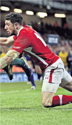  ??  ?? Not again: Australia’s Kurtley Beale dives over in the corner to score a last-minute match-winning try in Cardiff in 2012