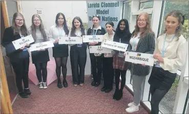  ?? ?? TY and fifth year group with the countries they represente­d at the Model UN in Clonmel.