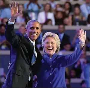  ?? AP/MARK J. TERRILL ?? President Barack Obama is joined onstage after his speech Wednesday night by Democratic presidenti­al nominee Hillary Clinton.