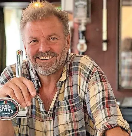  ?? ?? Under The Hammer, behind the bar of the Hendrewen Hotel in Blaencwm, Rhondda, which he now owns