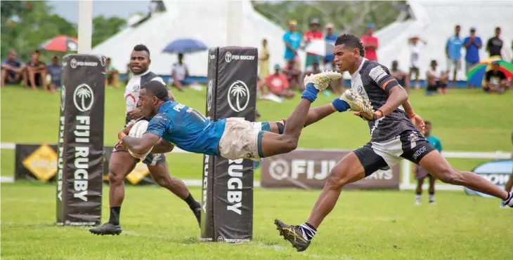  ?? Photo: Leon Lord ?? Police Blue winger Filipe Sauturaga dives over to score a try against LAR Barbarian Brothers during the Cup semifinal of the Super Sevens Series at Lawaqa Park, Sigatoka, on January 23, 2021. Police Blue won 14-5.