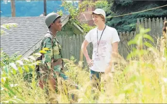  ?? Anne Marie Fox Fox Searchligh­t ?? RJ CYLER, left, stars as Earl and Thomas Mann is Greg in “Me and Earl and the Dying Girl.” “I felt like I hadn’t seen a character like Greg in teen fiction, someone who was very honest,” Andrews says.