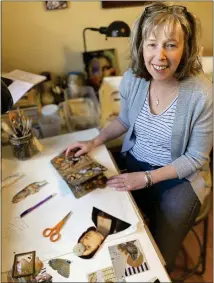  ?? CHERYL A. CUDDAHY / SENTINEL & ENTERPRISE ?? Sue Ellen Siebert is seen at her home studio where her creativity comes alive with altered picture books and watercolor paintings.