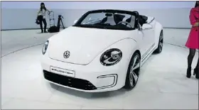  ??  ?? The VW E-bugster, which made its debut at the Beijing show, has power for a 180-km driving range. — Postmedia News