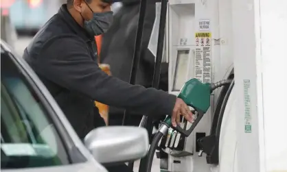  ?? Photograph: John Angelillo/UPI/Rex/Shuttersto­ck ?? A worker puts gas in the car of a customer in New York City. Americans are paying about $3.40 agallon compared with about $2.10 a year ago.