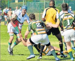  ??  ?? PULL DOWN: De Witt Stadler, of Brandwag, has his jersey tugged by Despatch prop Emelio Syse in their game