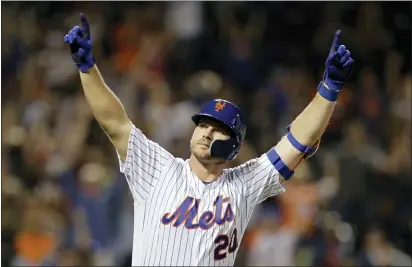  ?? ADAM HUNGER — THE ASSOCIATED PRESS FILE ?? The Mets’ Pete Alonso reacts after hitting a home run during the third inning of a game against the Braves in New York. The Mets’ first baseman and Houston Astros slugger Yordan Álvarez have been picked as this year’s top rookies by Baseball Digest.