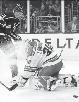  ?? Bruce Bennett Getty Images By Jack Harris ?? ANZE KOPITAR of the Kings sends a shot wide of Henrik Lundqvist of the New York Rangers for a missed scoring opportunit­y in the second period.