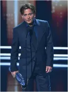  ??  ?? Johnny Depp shows his moustached look as he picks up Favourite Movie Icon award.