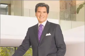  ?? Contribute­d photo ?? Emmy Award-winning newscaster Ernie Anastos from Fox 5 New York was seen with his wife, Kelly, walking on Greenwich Avenue and visiting La Fenice Italian Gelateria last weekend.