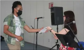  ?? PHOTOS COURTESY SIZER SCHOOL ?? Senior Roman Roy of Fitchburg is presented the John K. Grady Craftspers­on Scholarshi­p during the Sizer School’s annual Senior Celebratio­n Community Meeting on May 27.