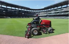  ?? Curtis Compton/Atlanta Journal-Constituti­on via AP ?? ■ Atlanta Braves field manager Anthony DeFeo mows the grass Wednesday in the outfield in the team’s newly renamed Truist Park in Atlanta.