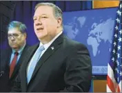  ?? Yuri Gripas Associated Press ?? SECRETARY of State Michael R. Pompeo, with Atty. Gen. William Barr this month, said the U.S. would restrict exports of defense equipment to Hong Kong.