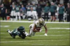  ?? BILL FEIG — THE ASSOCIATED PRESS ?? New Orleans Saints wide receiver Tre’Quan Smith (10) is tackled by Eagles cornerback Cre’von LeBlanc (34) during last week’s game.