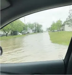  ?? GREG WALLIN ?? Flooding in Lampman, in the southeast of the province, has overloaded sanitary sewers and damaged streets.