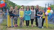  ??  ?? MSP Kate Forbes opens the play park with, from left, volunteers Renee Mason and Mags McGlynn, Nick Duffill from Minginish Community Hall Committee and some of the children who enjoyed the day.