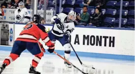  ?? MARK SELDERS/PENN STATE ATHLETICS ?? Penn State's Tessa Janecke (15), a sophomore from Orangevill­e, tries get the puck past a Rochester Institute of Technology defender during a Feb. 23 game.