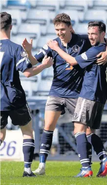  ??  ?? Wonder strike Dario Zanatta is congratula­ted on his goal