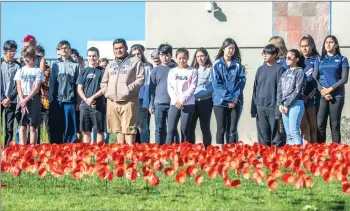  ?? Austin Dave/The Signal ?? (Above) To honor the 1,000 California­ns who were killed during World War I, West Ranch High School planted 1,000 handcrafte­d red poppies on the 100th anniversar­y of Armistice Day, which is commemorat­ed annually on Nov. 11. In countries like Great Britain and Canada, the red poppy is used to commemorat­e Armistice Day. See A8 for a list of Santa Clarita Valley veterans.