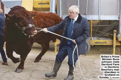  ?? REUTERS ?? Britain’s Prime Minister Boris Johnson visits Darnford Farm in Darnford, Banchory near Aberdeen in Scotland on Sunday.