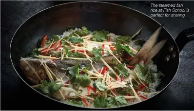  ??  ?? The steamed fish rice at Fish School is perfect for sharing