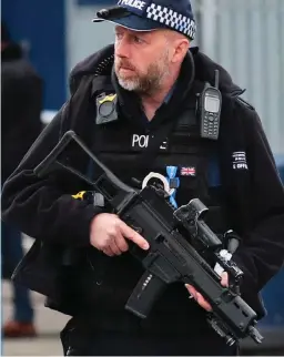  ??  ?? Patrol: Armed police at London City Airport yesterday