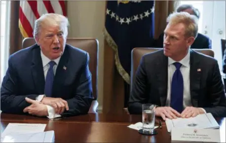  ?? AP PHOTO/EVAN VUCCI ?? In this April 9, 2018, file photo, Deputy Secretary of Defense Patrick Shanahan, right, listen as President Donald Trump speaks.