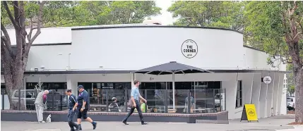  ?? REUTERS/ MCDONALD’S CORP ?? People walk past The Corner cafe in Sydney in this handout photo made available to Reuters on Tuesday.