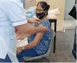  ?? Supplied ?? DHANALUTCH­MEE Moodley, a resident at ABH in Chatsworth, receives her shot of the vaccine. |