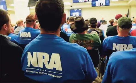  ?? NRA / Contribute­d photos ?? Above, National Rifle Associatio­n members attend a meeting. The NRA filed for bankruptcy protection in Texas on Jan. 15, saying New York had “weaponized the legal and regulatory powers” and “unlawfully singled out (the NRA) for its Second Amendment advocacy.” At right, Wayne LaPierre, NRA’s CEO and executive vice president.