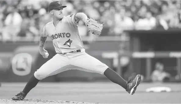  ?? BRIAN DAVIDSON / GETTY IMAGES ?? Toronto starter Sean Reid-foley was saddled with a 3-1 loss in his major-league debut on Monday night in Kansas City, pitching five innings in the start.