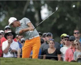  ?? CHRIS O’MEARA — ASSOCIATED PRESS ?? Rickie Fowler hits his tee shot on the 17th hole during the final round of the PGA Championsh­ip.