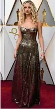  ??  ?? Jennifer Lawrence stuns bronze. in