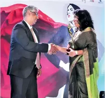  ??  ?? Rocco’s Joint Managing Director Judy Wikkramati­llake receiving award from Sports, Provincial Councils and Local Government Minister Faizer Mustapha