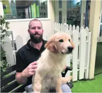  ?? Courtesy Nakheel ?? Archie the golden retriever, with his owner Sean, may soon undergo a surgery for his congenital heart condition.