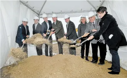  ?? BARRY GRAY HAMILTON SPECTATOR FILE PHOTO ?? Politician­s and executives from Panattoni throw dirt at the ground breaking for a new industrial develoment on Aeropark Road near Hamilton Internatio­nal Airport. It is estimated new industrial and commercial land will generate up to $21 million in new taxes.