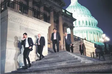  ??  ?? Members of the House of Representa­tives leave after a vote on Capitol Hill after the House and Senate moved to end a government shutdown in Washington, DC. — AFP photo