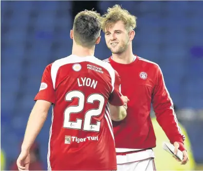  ??  ?? Shake on it Scorers David Templeton and Darren Lyon were delighted with the 2-0 win at Ibrox