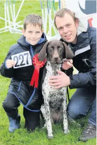  ??  ?? Proud pooch Aston Moore, 10, and Grant Lithgow with German shorthaire­d pointer Ava