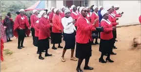  ?? (Pics: Sibusiso Shange) ?? Members of the Methodist Church singing and dancing around the newly-built four-room house before it was officially handed over to the family of eight children at Dlangeni on Saturday.