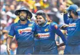  ?? AFP ?? Wanidu Hasaranga (centre) celebrates with teammates.