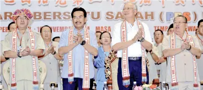  ??  ?? PM Datuk Seri Najib Tun Razak (second right), CM Datuk Seri Musa Aman, PBS president Datuk Seri Joseph Pairin Kitingan and PBS vice-president Datuk Dr Maximus Ongkili (left) at the 29th PBS annual delegates conference at Likas Sports Complex in Kota...