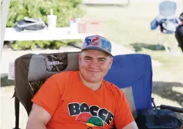  ?? GARY SCHOTTLE via AP ?? Derek “Tank” Schottle takes a break at the Texas Special Olympics, where he and his father won the gold medal in a bocce tournament in 2017.