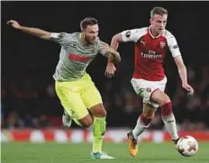  ?? AFP ?? Arsenal defender Rob Holding (right) vies with FC Cologne’s midfielder Marco Hoger (L) during the match.