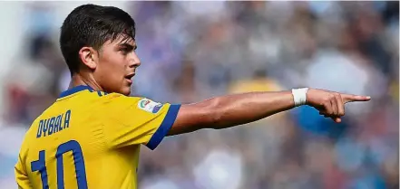  ??  ?? An oddity: Paulo Dybala has bagged 10 goals in Serie A but yet to open his tally in the Champions League. — AFP